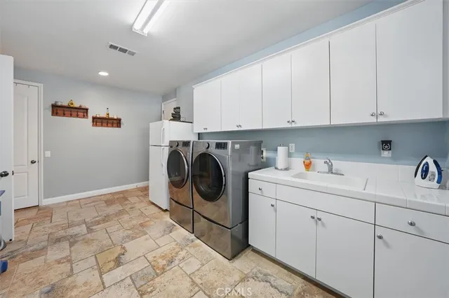 a bed room with furniture and a flat screen tv