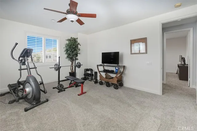 a view of entrance gate of the house and wooden fence