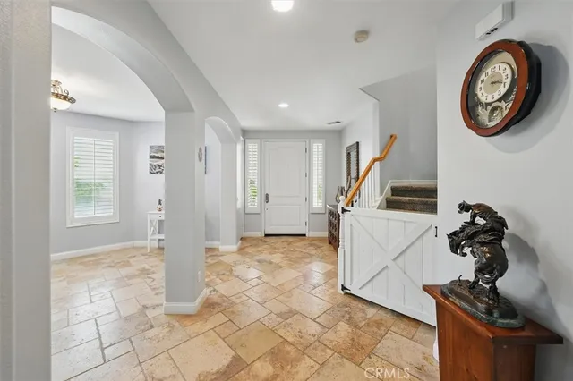 a living room with furniture window and fireplace