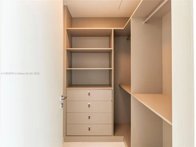 a view of an empty walk in closet