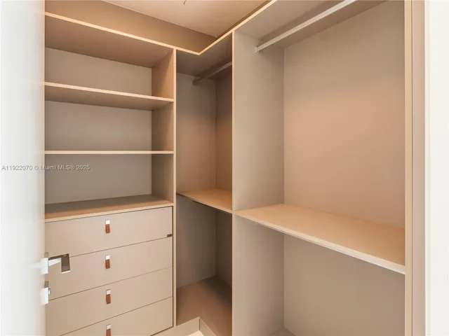 a view of an empty walk in closet