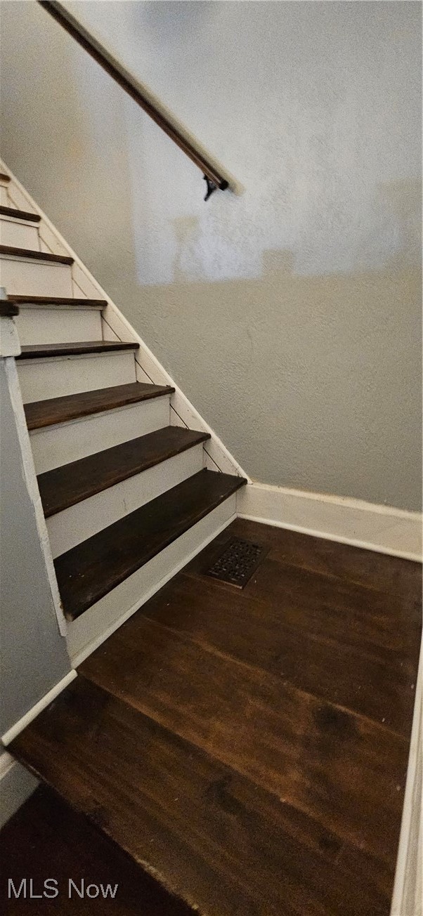 52 Salt Street Rittman, OH 44270 - Photo 17 of 34 Stairs with baseboards and wood finished floors