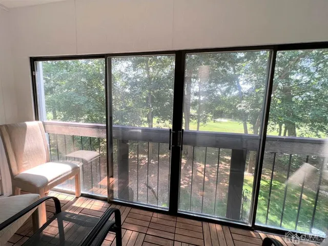 a view of a city from a room with balcony