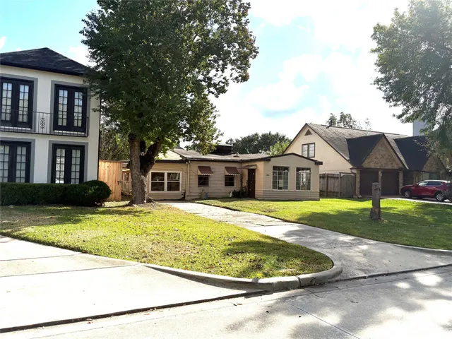a front view of a house with a yard and porch