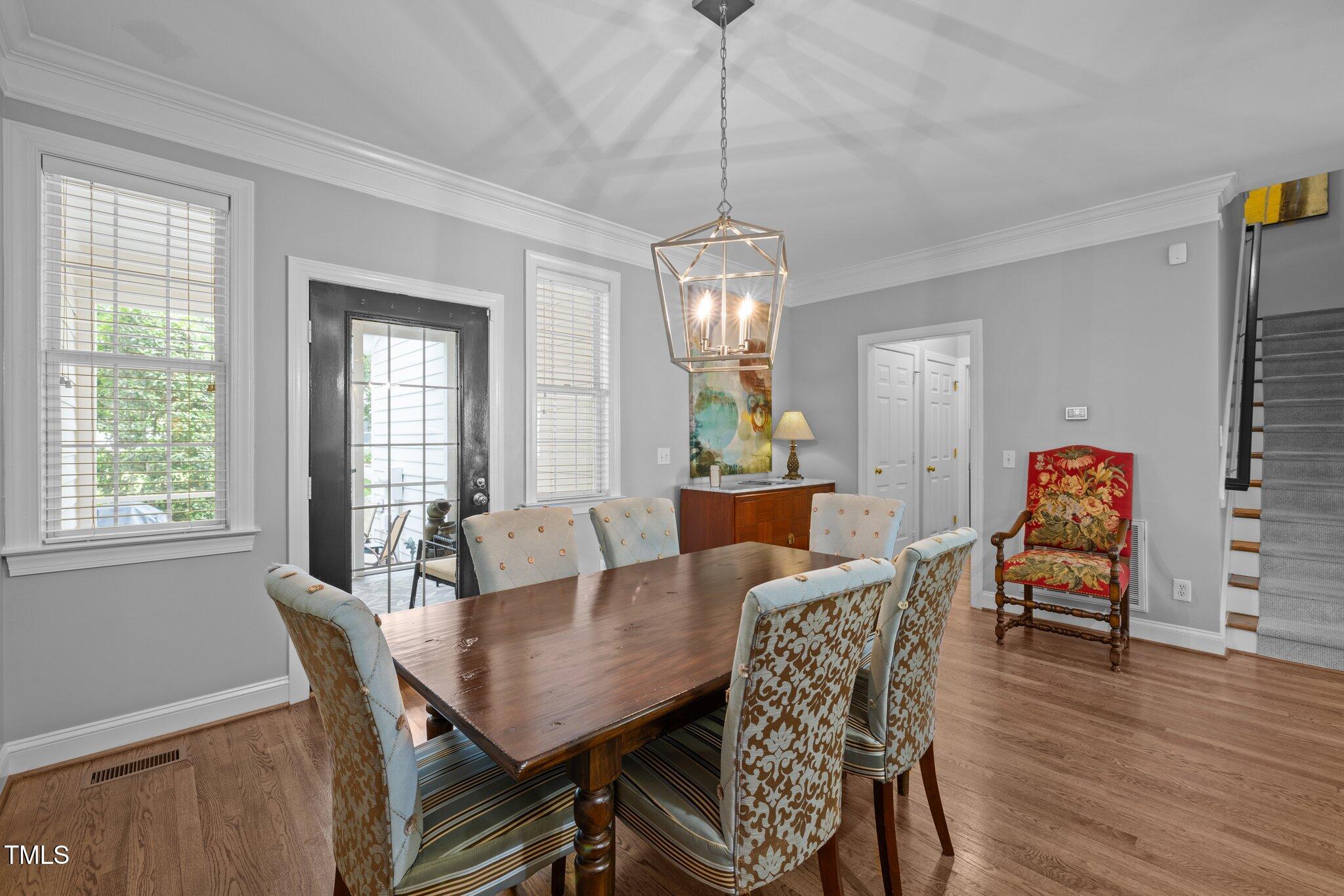 3902 Stags Leap Circle Raleigh, NC 27612 - Photo 19 of 53 a view of a dining room with furniture window and wooden floor