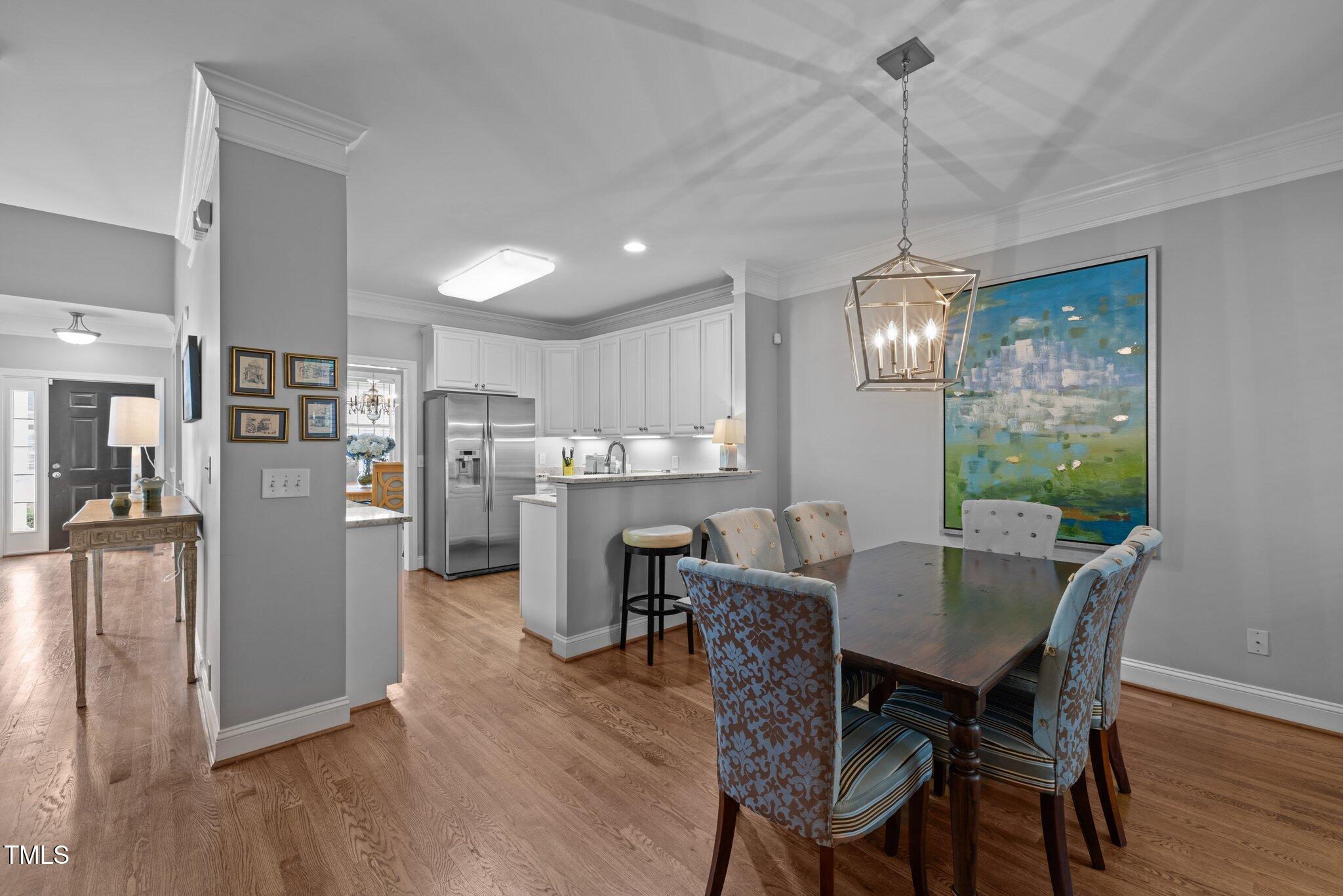3902 Stags Leap Circle Raleigh, NC 27612 - Photo 20 of 53 a view of a dining room with furniture window and wooden floor