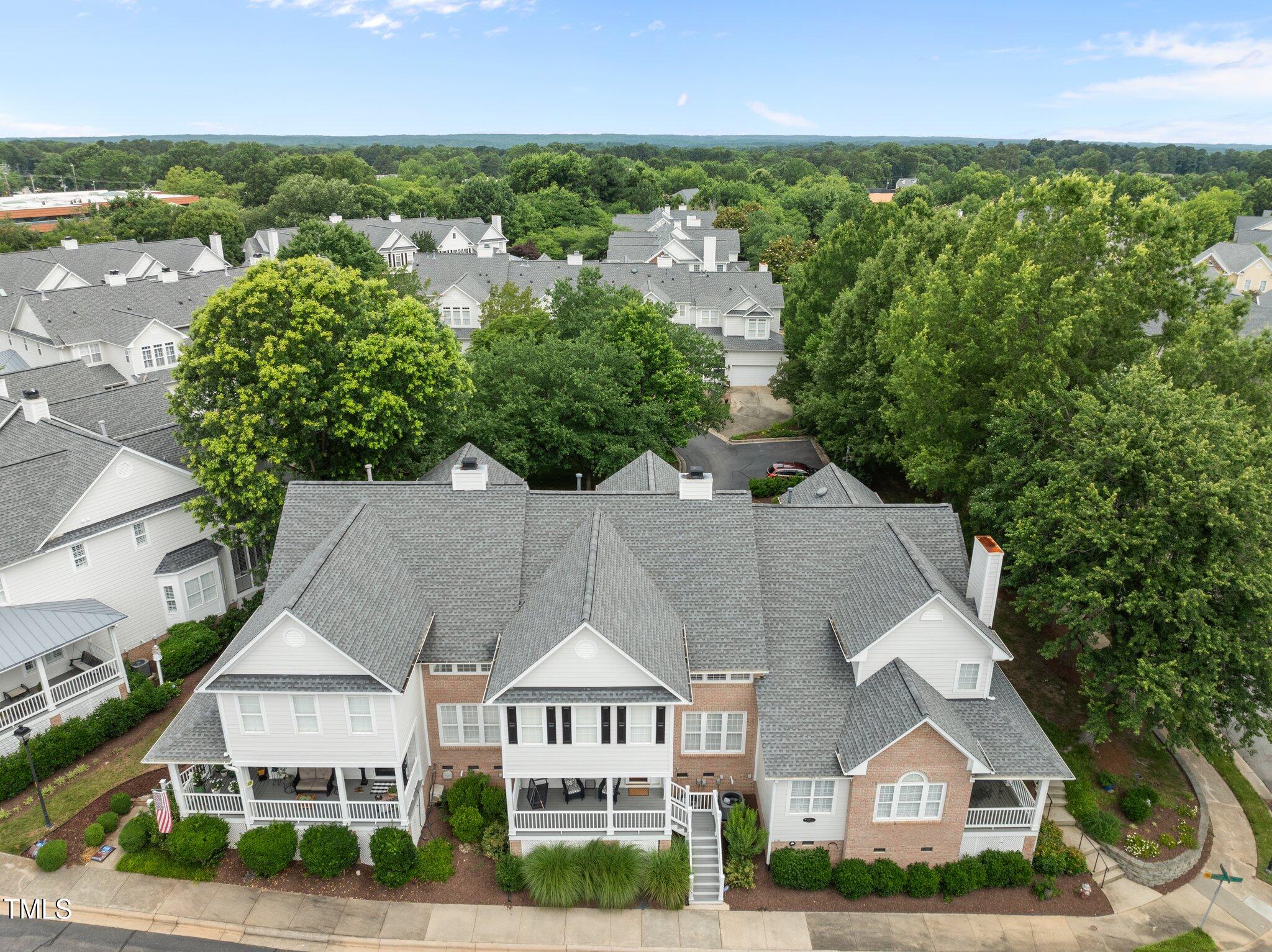3902 Stags Leap Circle Raleigh, NC 27612 - Photo 3 of 53 an aerial view of residential houses with outdoor space and trees