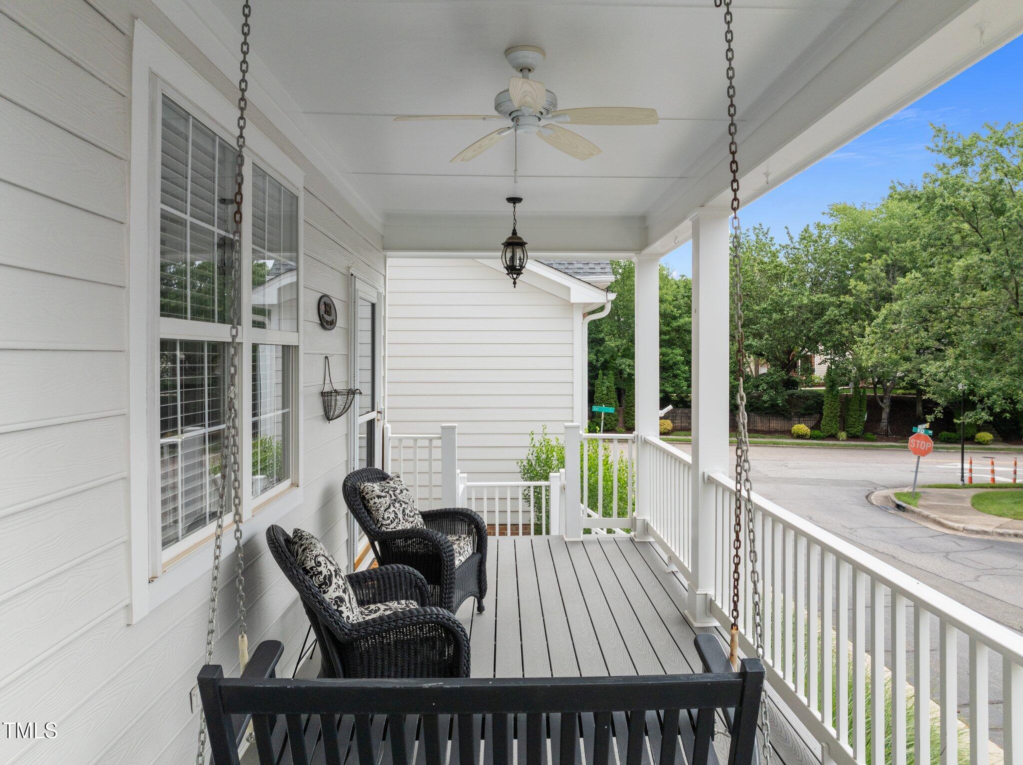 3902 Stags Leap Circle Raleigh, NC 27612 - Photo 5 of 53 a view of a deck with couches table and chairs and wooden floor