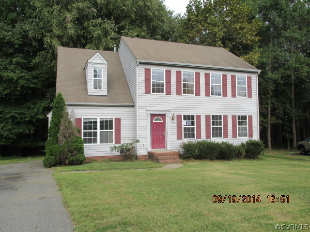 3208 Purvis Road Richmond, VA 23223 - Photo 1 of 10 a front view of a house with garden