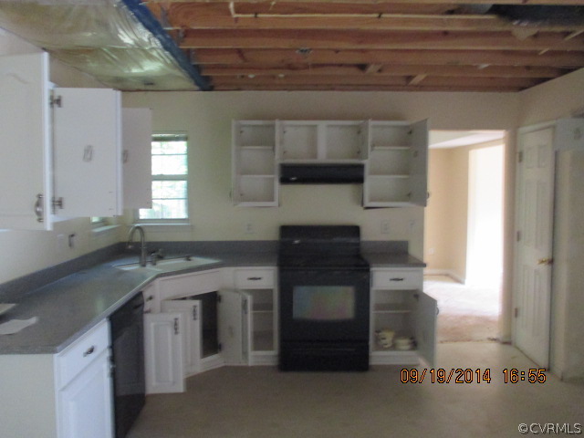 3208 Purvis Road Richmond, VA 23223 - Photo 3 of 10 a kitchen with a sink and cabinets