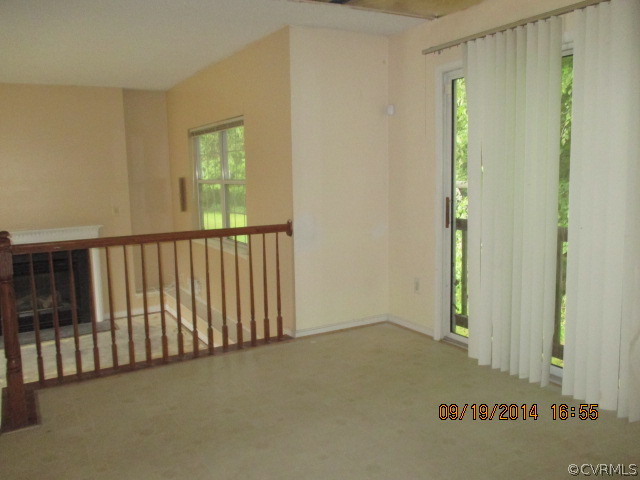 3208 Purvis Road Richmond, VA 23223 - Photo 4 of 10 a view of a hallway with a window