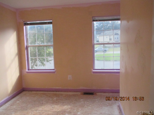 3208 Purvis Road Richmond, VA 23223 - Photo 7 of 10 an empty room with windows