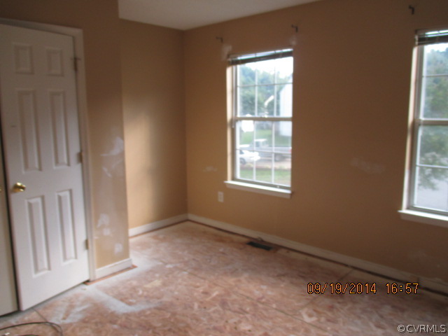 3208 Purvis Road Richmond, VA 23223 - Photo 8 of 10 an empty room with windows
