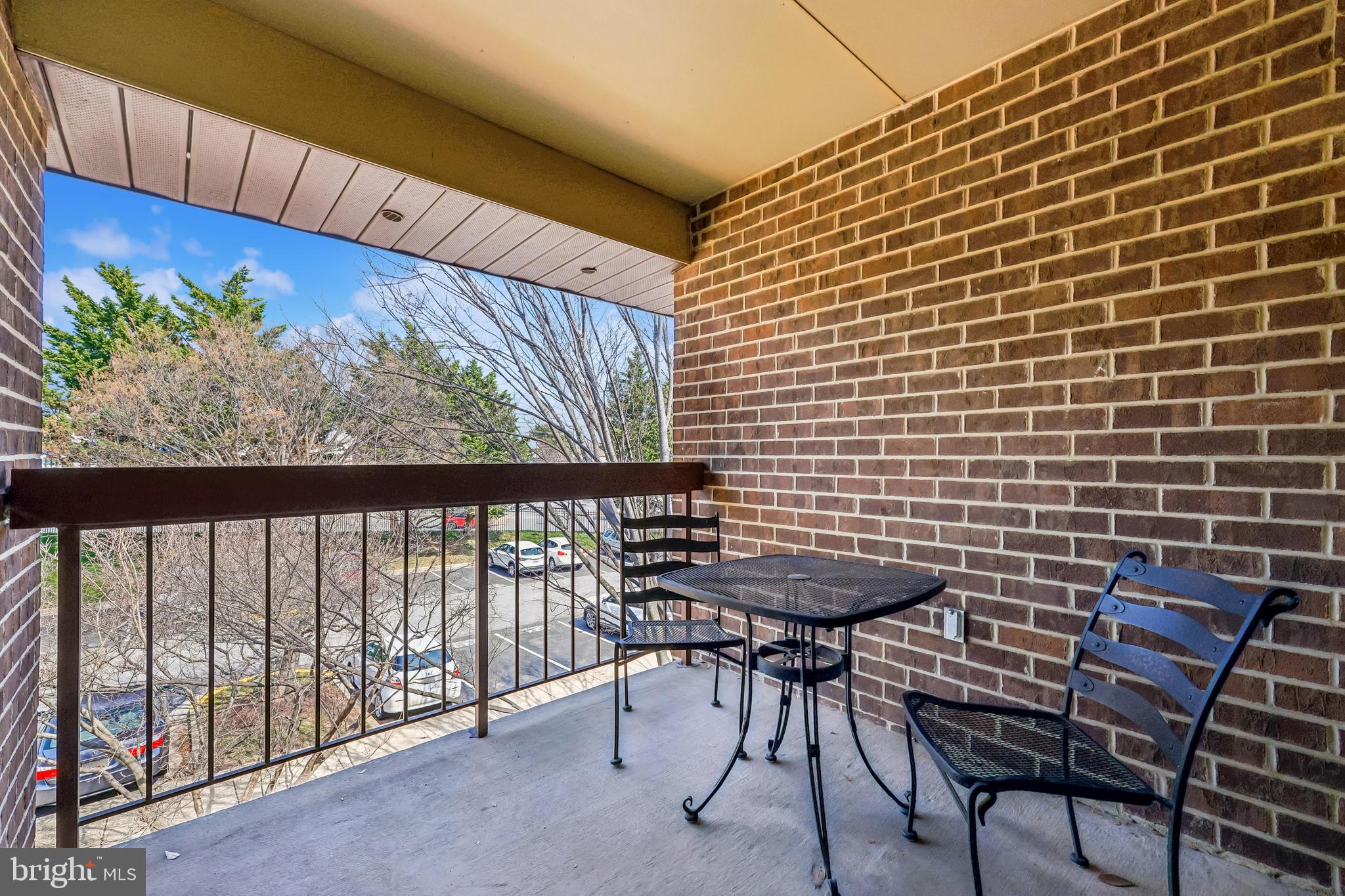 7804 Guildberry Court, Unit 301 Gaithersburg, MD 20879 - Photo 15 of 33 a view of a chairs and table in the balcony
