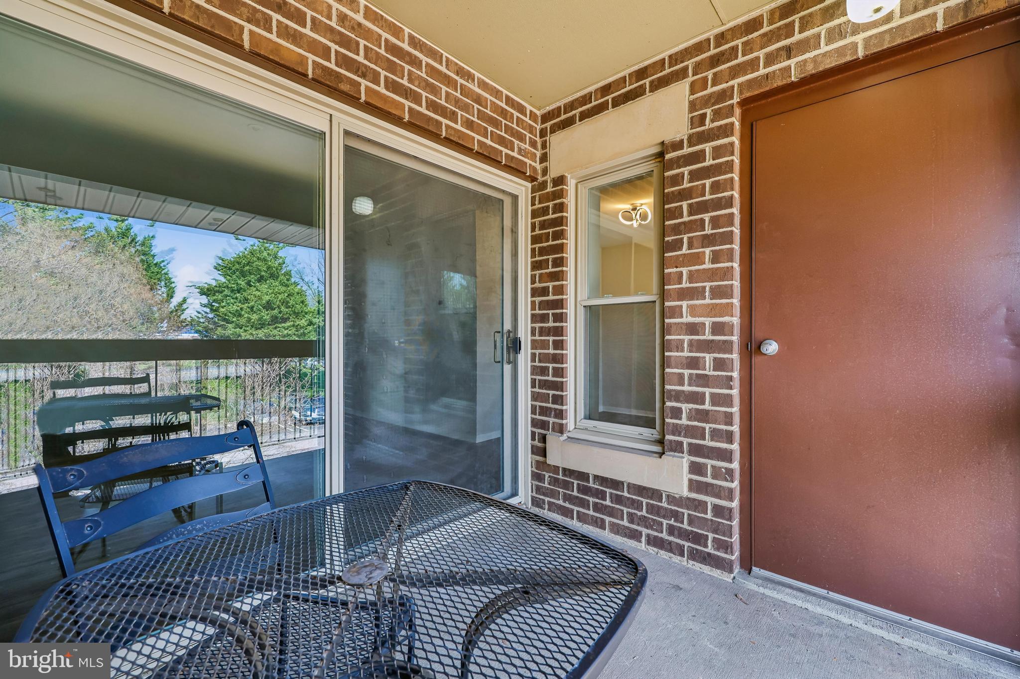 7804 Guildberry Court, Unit 301 Gaithersburg, MD 20879 - Photo 16 of 33 a view of a balcony with couch