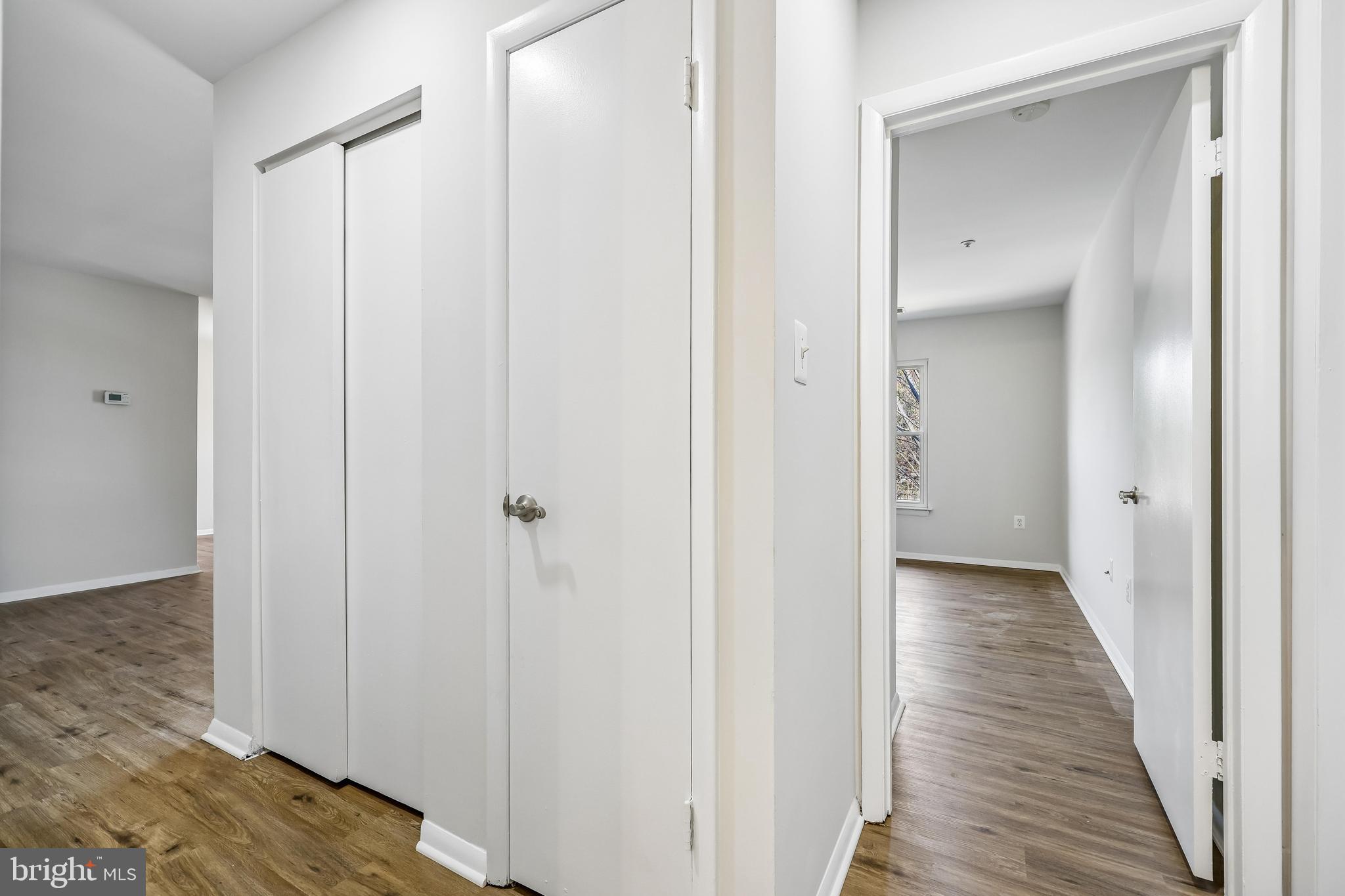 7804 Guildberry Court, Unit 301 Gaithersburg, MD 20879 - Photo 20 of 33 a view of a hallway with wooden floor