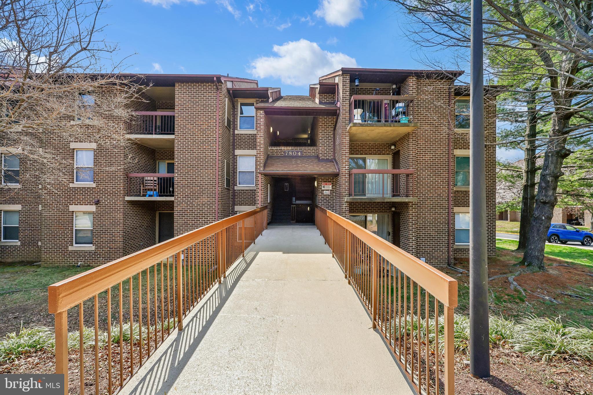 7804 Guildberry Court, Unit 301 Gaithersburg, MD 20879 - Photo 2 of 33 a view of a building from a balcony