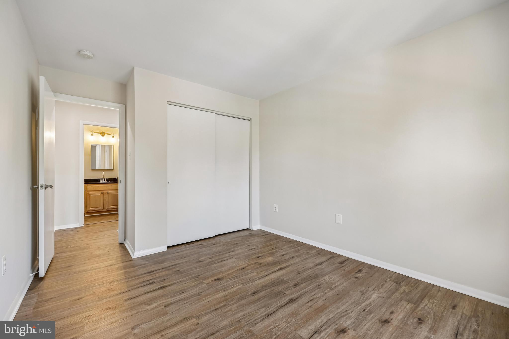 7804 Guildberry Court, Unit 301 Gaithersburg, MD 20879 - Photo 23 of 33 wooden floor in a empty room