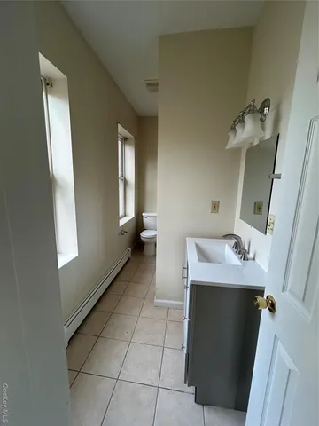 a bathroom with a sink and mirror