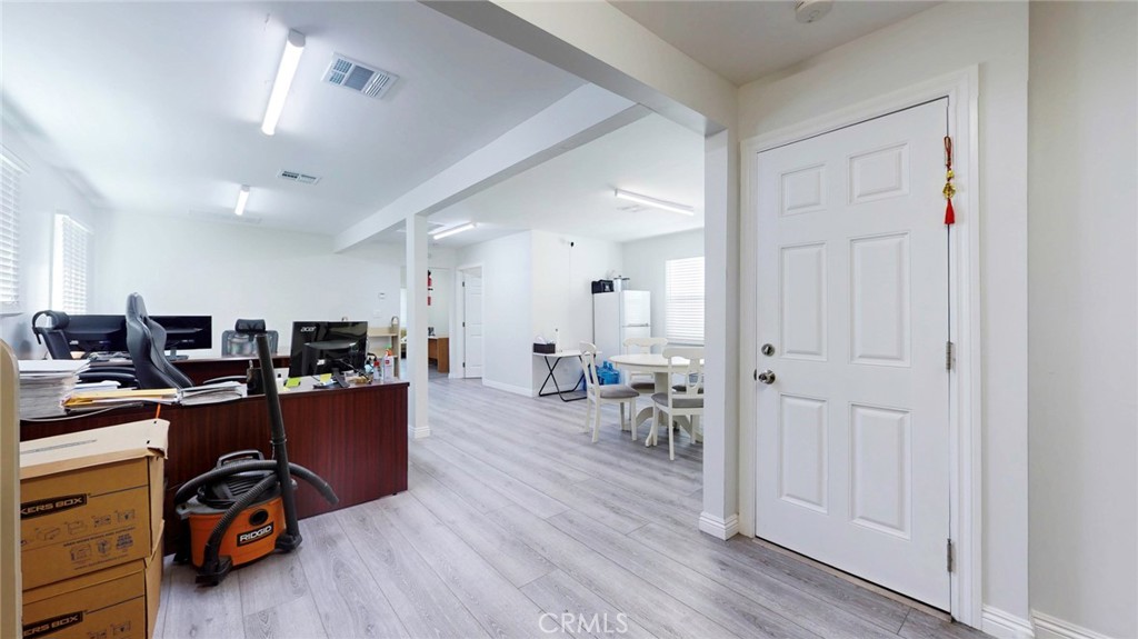 6851 Foothill Boulevard Tujunga, CA 91042 - Photo 21 of 50 a view of a workspace with furniture and wooden floor