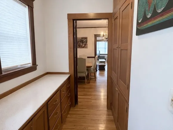a view of a big room with wooden floor and staircase
