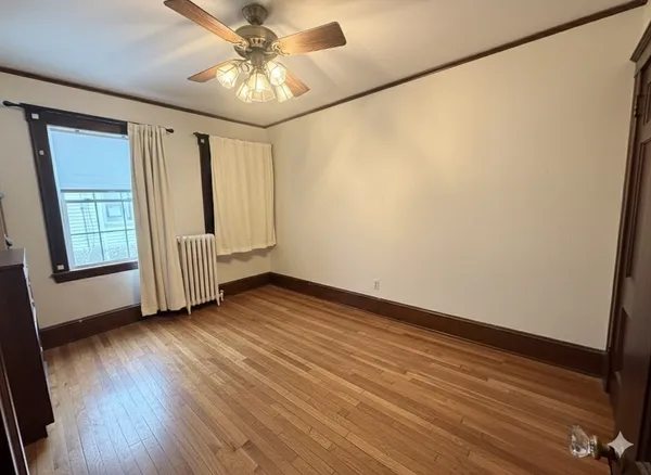 a bathroom with a sink a toilet and shower curtain