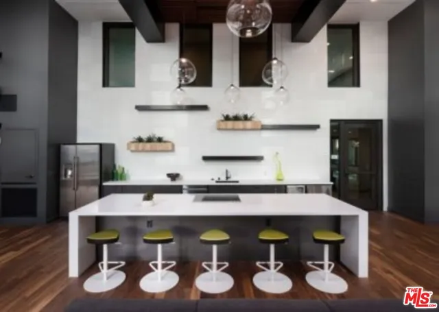 a view of a dining room with a table and chairs