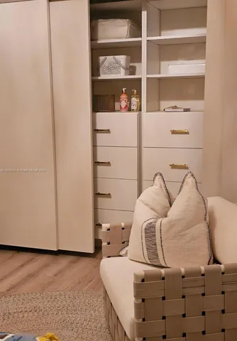 a view of staircase with a rug and a window