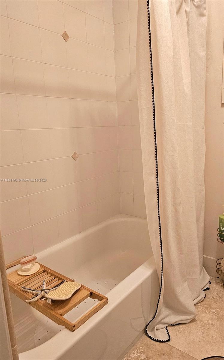 131 Zamora Avenue, Unit 2 Coral Gables, FL 33134 - Photo 15 of 17 a bathroom with a bathtub