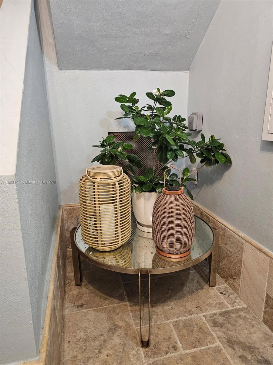 131 Zamora Avenue, Unit 2 Coral Gables, FL 33134 - Photo 17 of 17 a vase of flowers sitting on a table