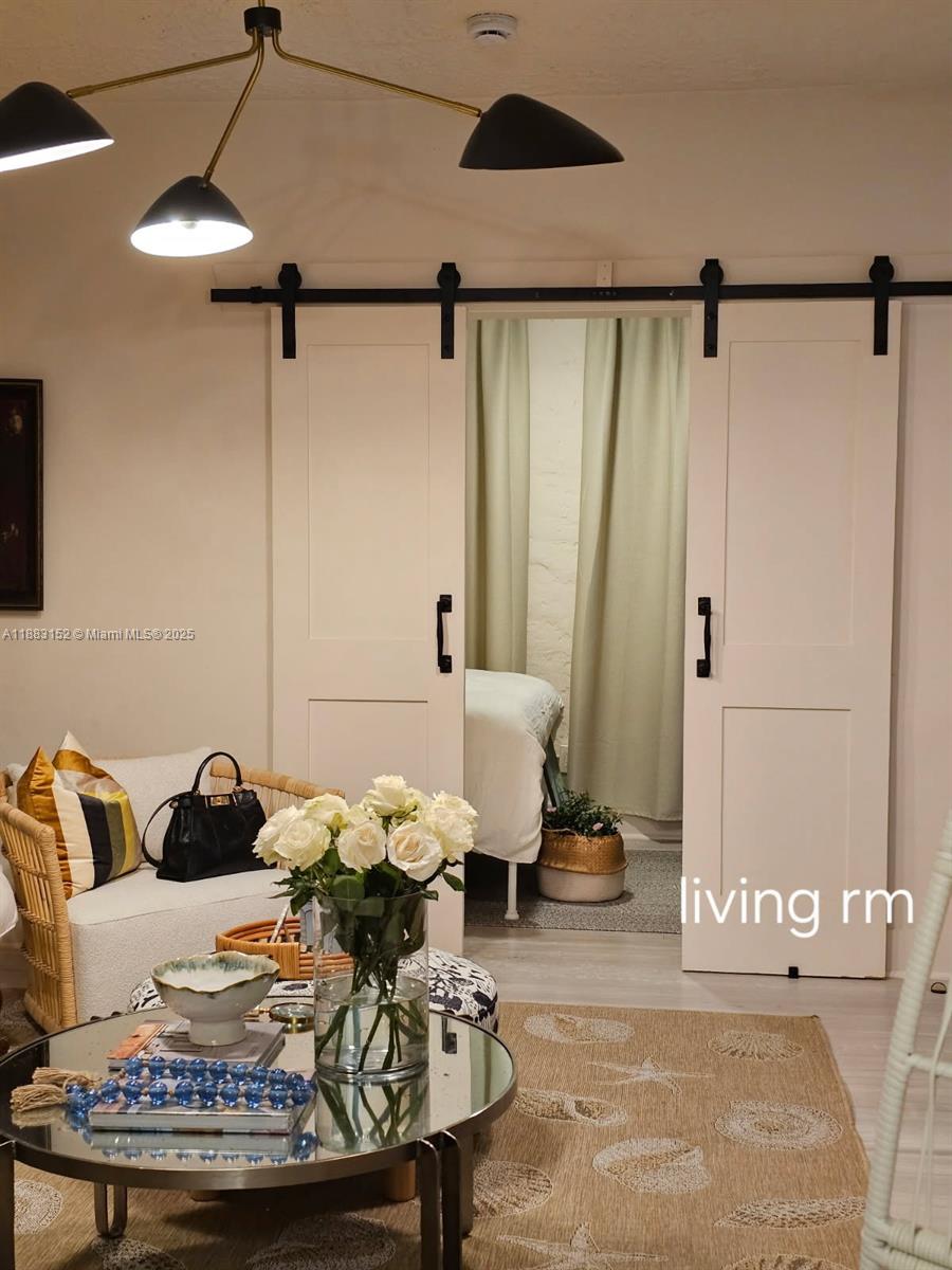 131 Zamora Avenue, Unit 2 Coral Gables, FL 33134 - Photo 3 of 17 a living room with furniture