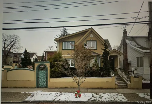 a front view of a house with garage