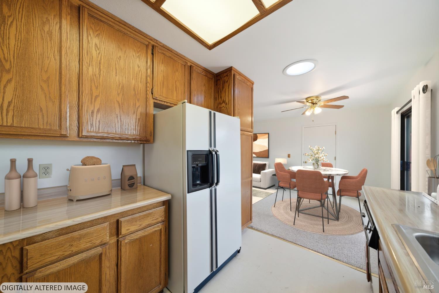 2654 Edison Street Graton, CA 95444 - Photo 13 of 63 a kitchen with stainless steel appliances a refrigerator a stove a sink dishwasher and white cabinets with wooden floor