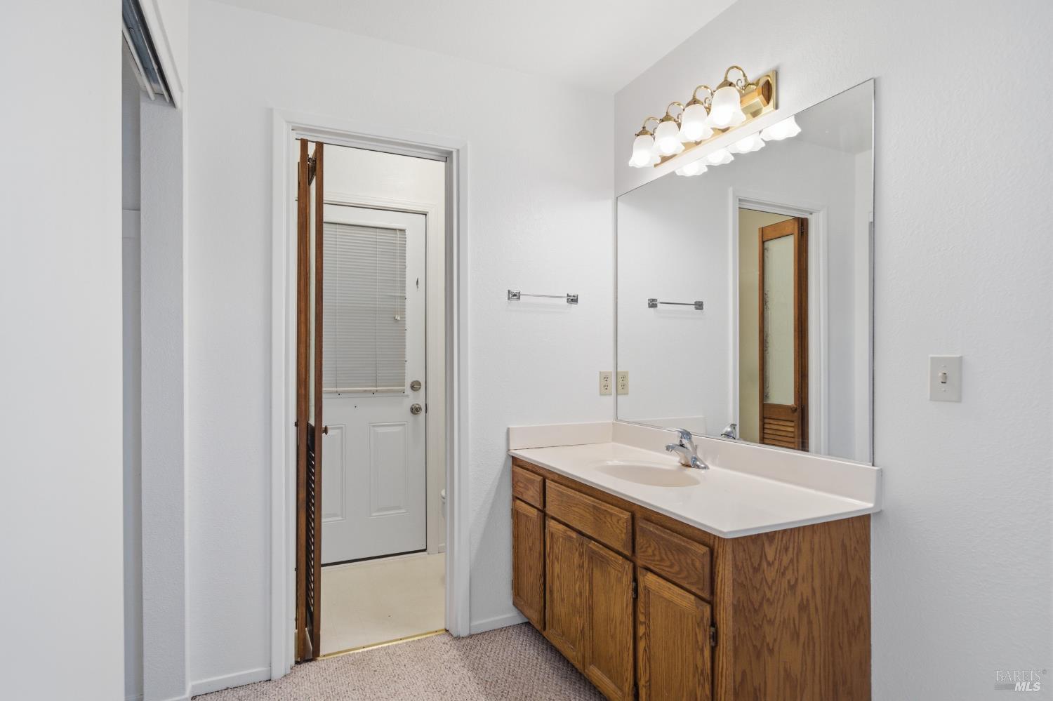 2654 Edison Street Graton, CA 95444 - Photo 54 of 63 a bathroom with a sink vanity and a mirror
