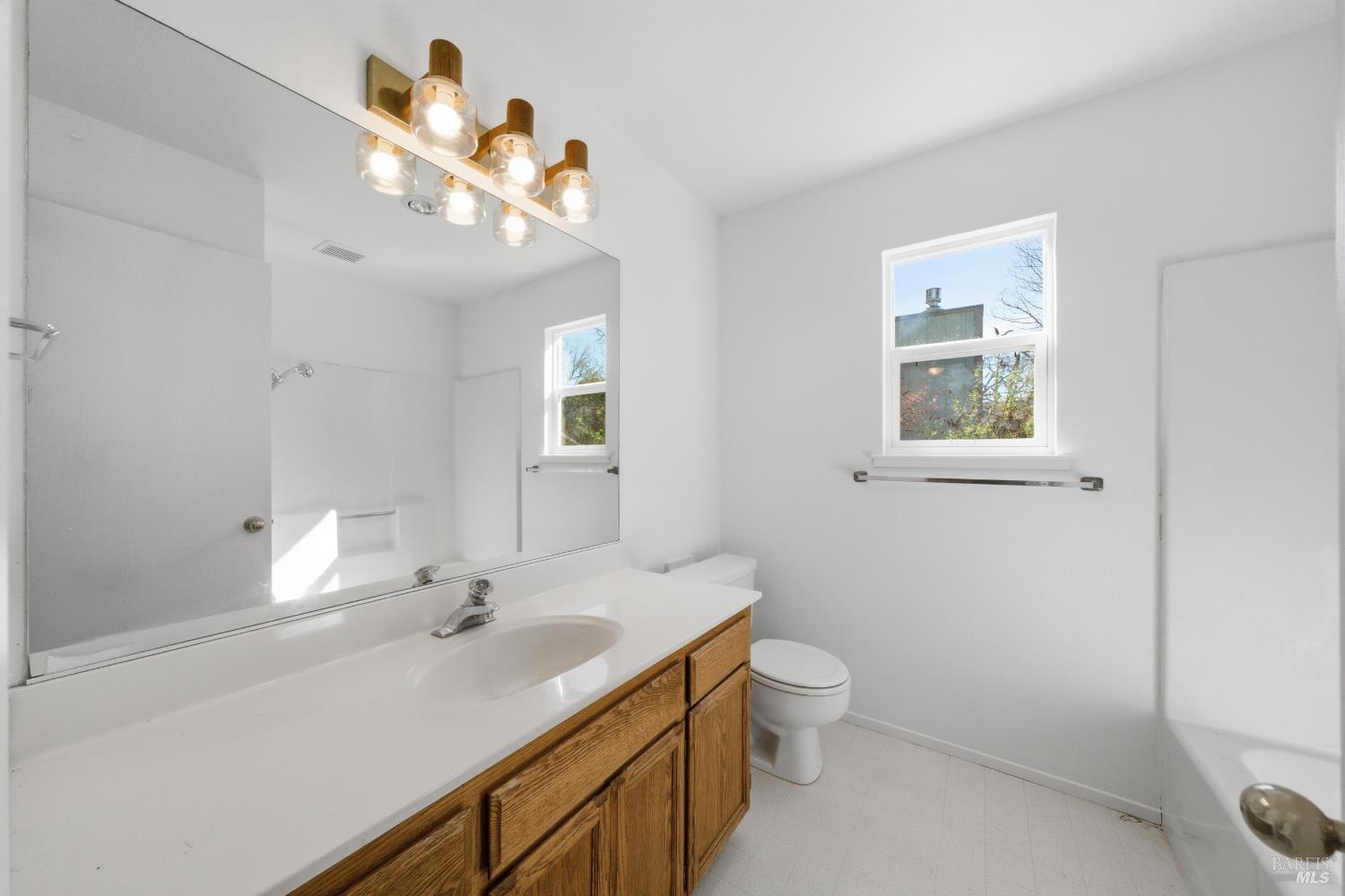 2654 Edison Street Graton, CA 95444 - Photo 62 of 63 a bathroom with a sink a toilet and a mirror