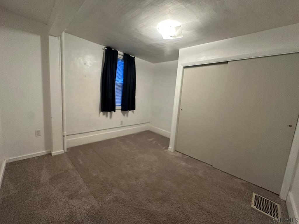 312 12th Street Windber, PA 15963 - Photo 17 of 24 an empty room with an empty space and window