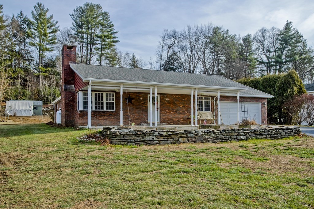 146 Huntington Road Russell, MA 01071 - Photo 1 of 42 a front view of a house with garden