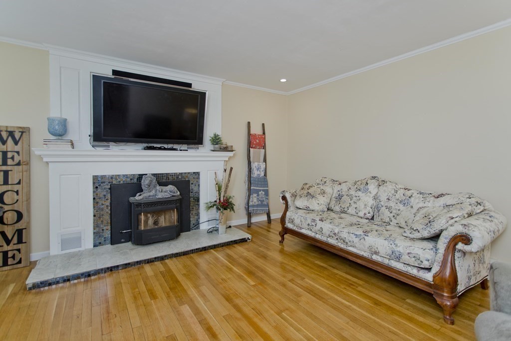146 Huntington Road Russell, MA 01071 - Photo 17 of 42 a living room with furniture a flat screen tv and a fireplace