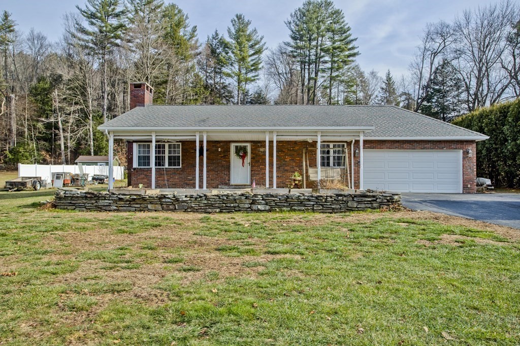 146 Huntington Road Russell, MA 01071 - Photo 2 of 42 a front view of a house with a yard