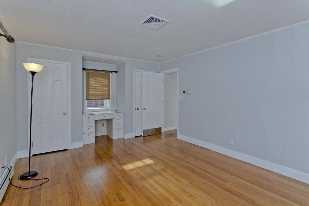 146 Huntington Road Russell, MA 01071 - Photo 21 of 42 a view of empty room with a fireplace and wooden floor