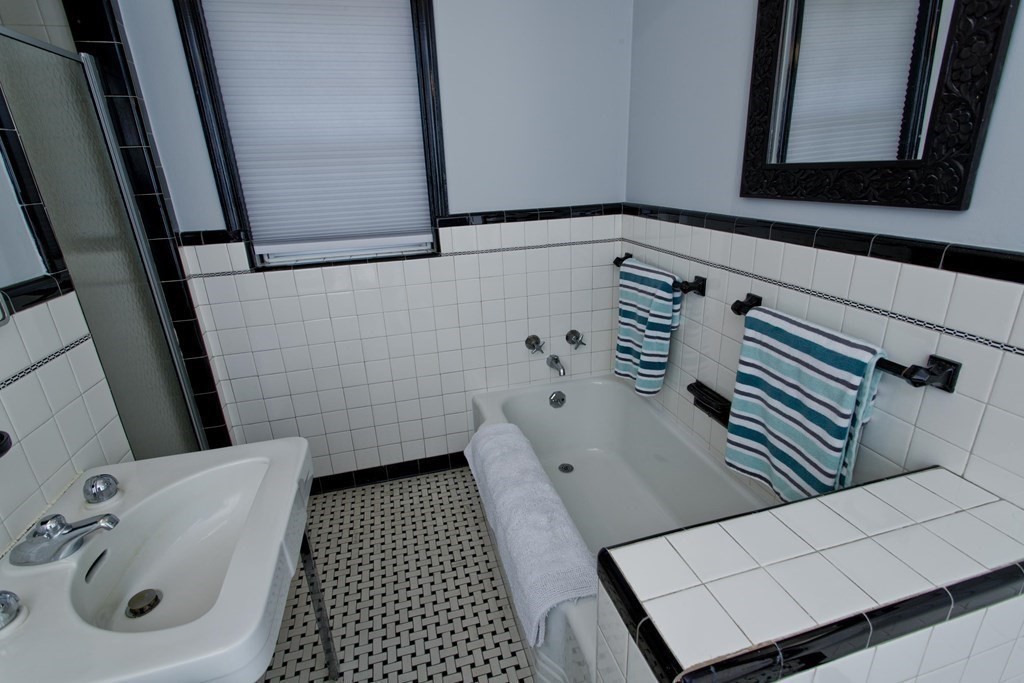 146 Huntington Road Russell, MA 01071 - Photo 23 of 42 a bathroom with a sink a toilet and a mirror