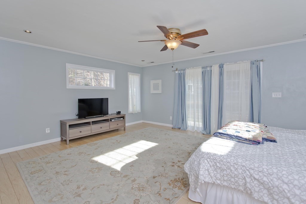 146 Huntington Road Russell, MA 01071 - Photo 27 of 42 a bedroom with a bed and a flat screen tv