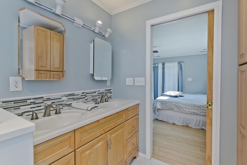 146 Huntington Road Russell, MA 01071 - Photo 36 of 42 a en suite bathroom with a sink and a mirror