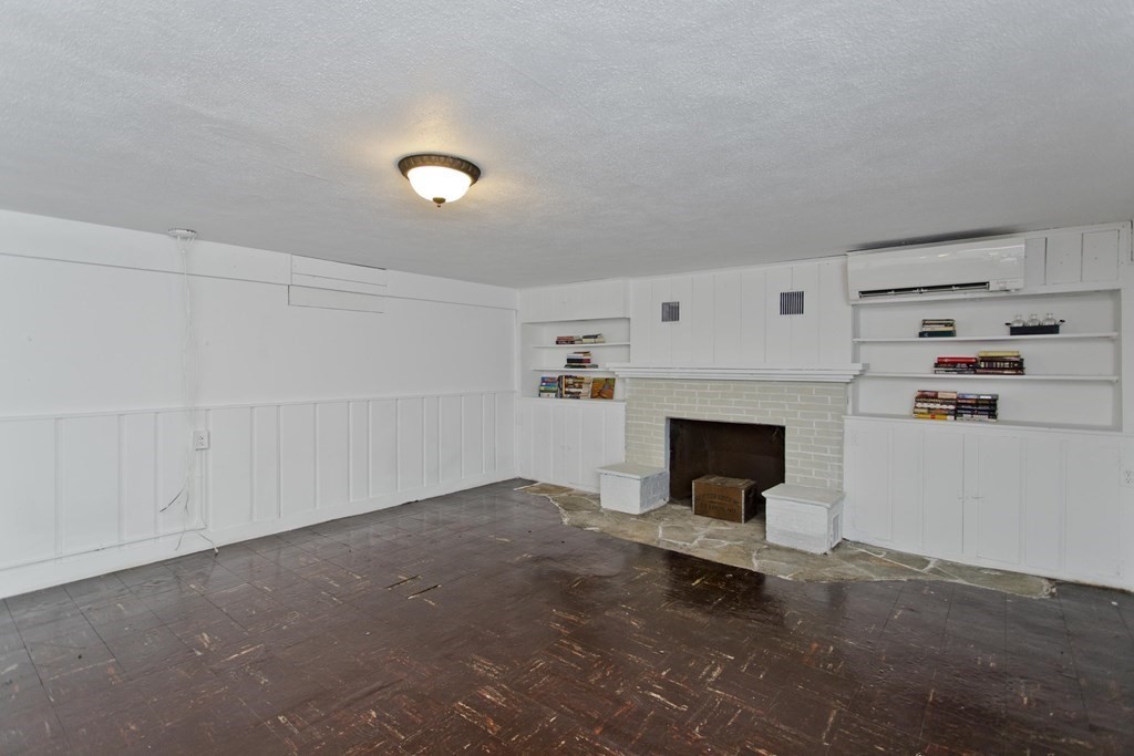 146 Huntington Road Russell, MA 01071 - Photo 37 of 42 a view of a livingroom with a fireplace and window