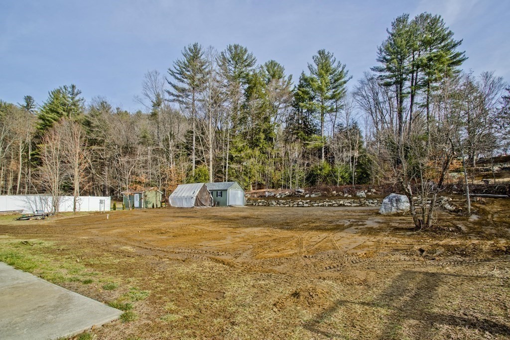 146 Huntington Road Russell, MA 01071 - Photo 40 of 42 a view of a yard with trees in the background