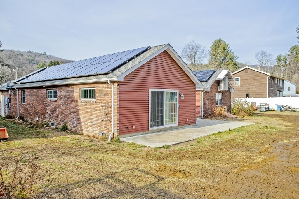 146 Huntington Road Russell, MA 01071 - Photo 42 of 42 a front view of a house with a yard