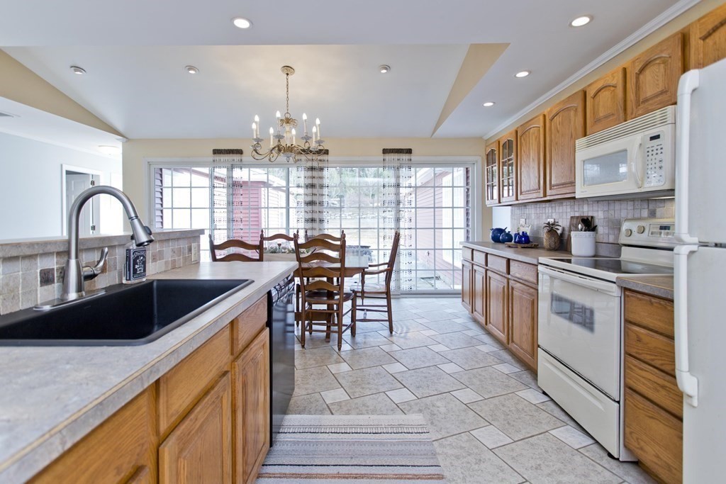 146 Huntington Road Russell, MA 01071 - Photo 7 of 42 a kitchen with granite countertop a sink and cabinets