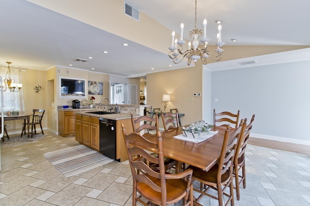 146 Huntington Road Russell, MA 01071 - Photo 8 of 42 a view of a dining room with furniture and chandelier