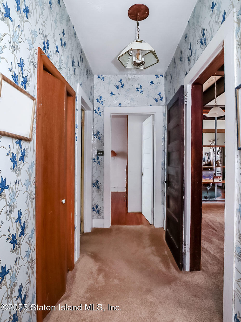 151 Clinton B Fiske Avenue Staten Island, NY 10314 - Photo 15 of 33 a view of a hallway with wooden shelves