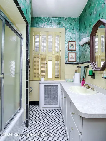a bathroom with a sink a vanity and a mirror